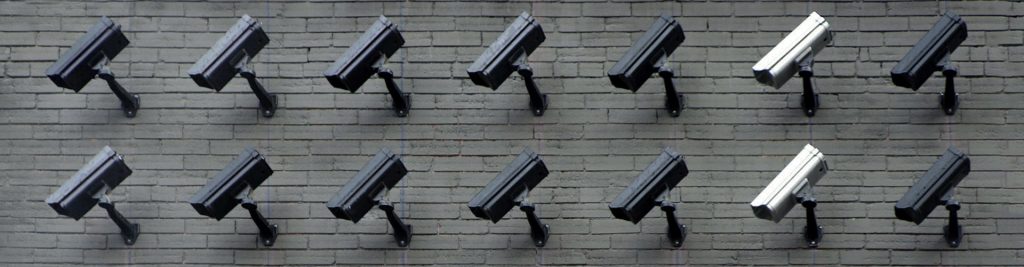 A wall of security cameras pointed down