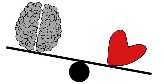 Illustration of a heart outweighing a brain on a scale
