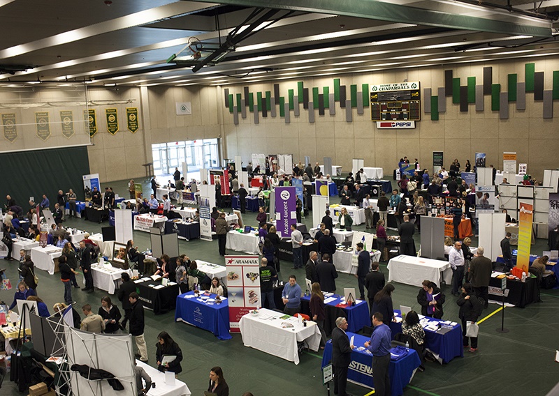 A photo shows job seekers and employers participating in the College of DuPage's third annual Career Fair.