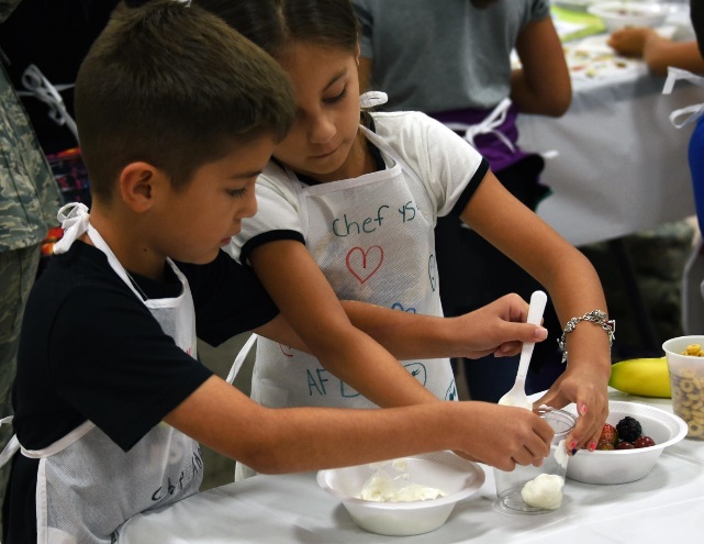 Picture of two children cooking