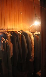 Picture of clothes on hangers in a cedar closet