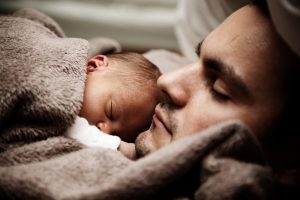 Father and infant sleeping
