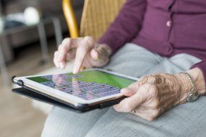 Elderly woman using i-pad