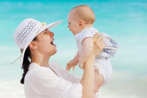 Mother looking into baby's face.