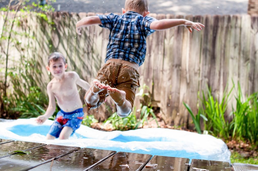Children jumping and swimming