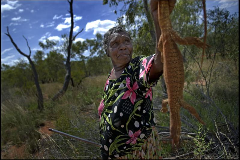 Woman with goanna