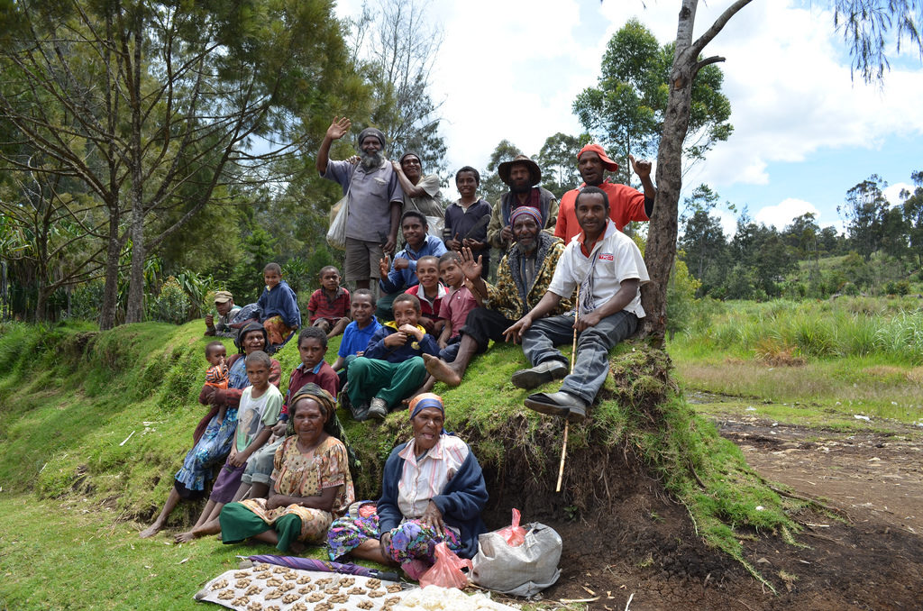 Group of smiling people posing for photo.