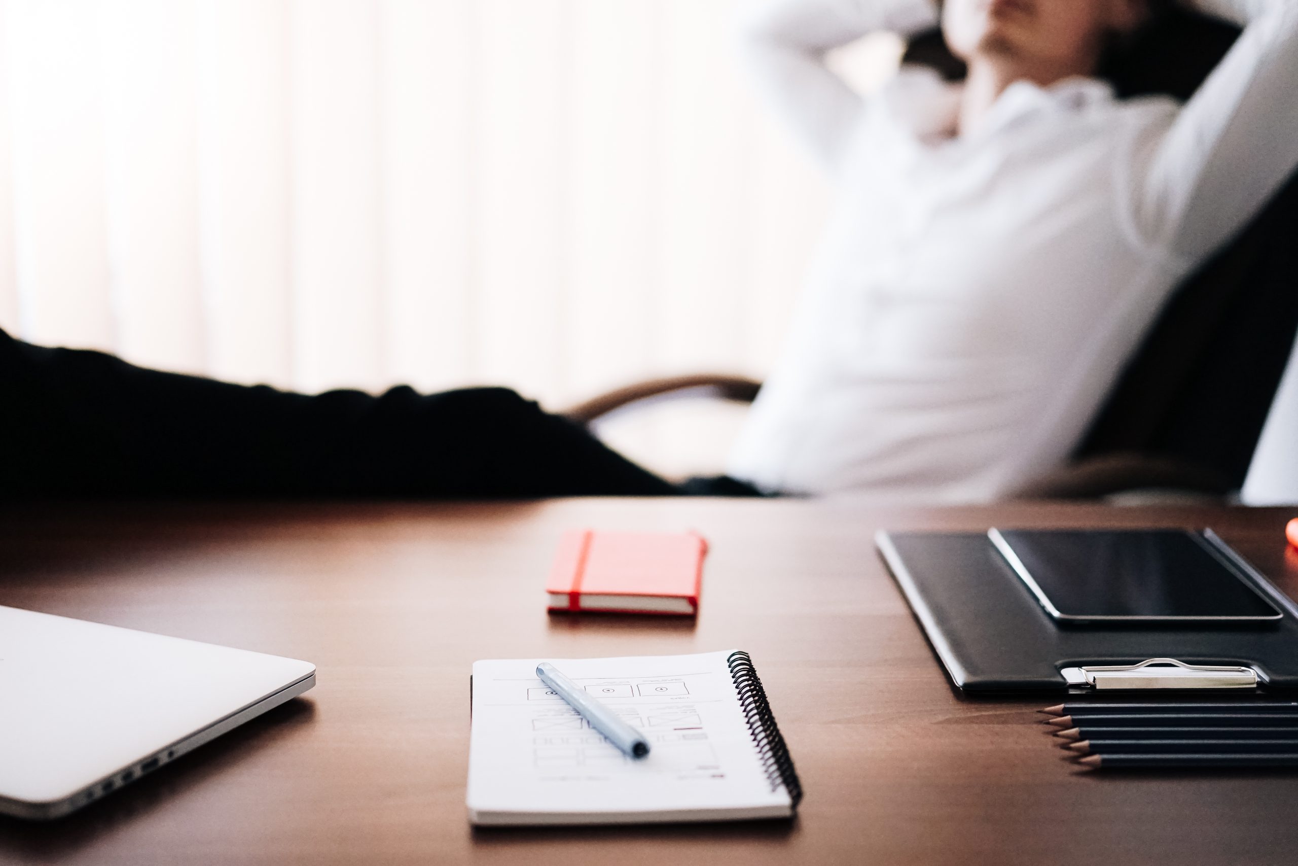 Man relaxing in office with legs up