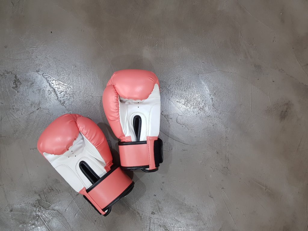 Boxing gloves sit on the floor