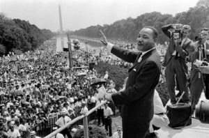 Dr. Martin Luther King, Jr. waves at the crowd on August 29 1963 at a civil rights rally in Washington DC