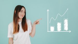 Woman points to a graph chart