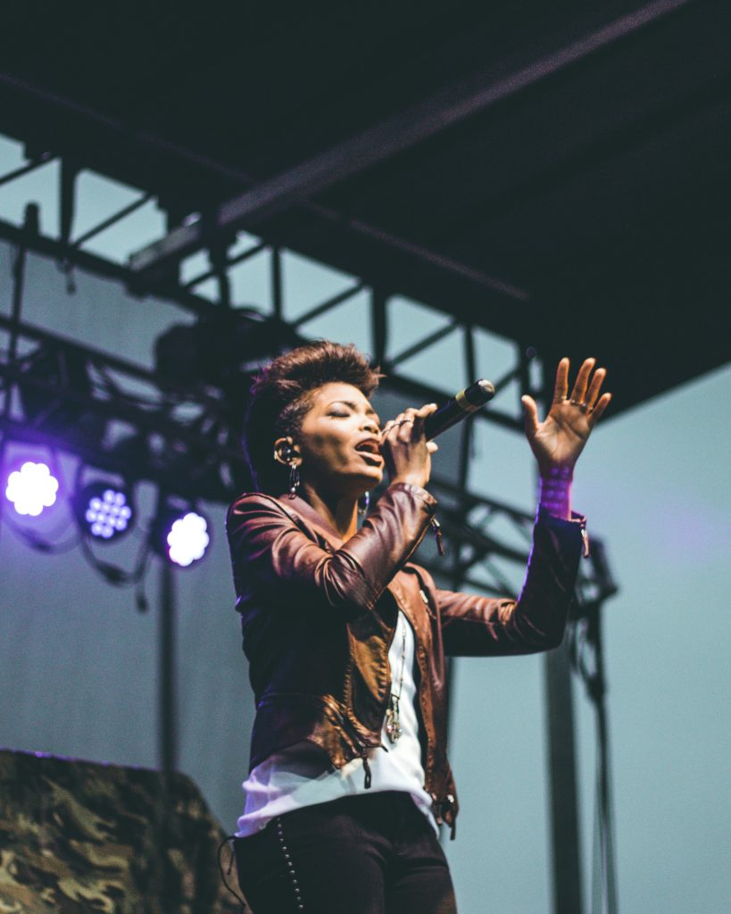 Woman singing on stage