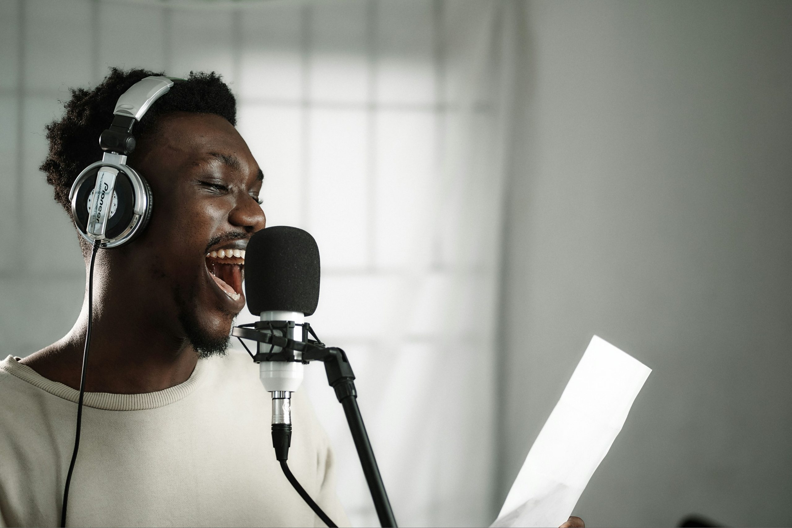 performer smiling and singing