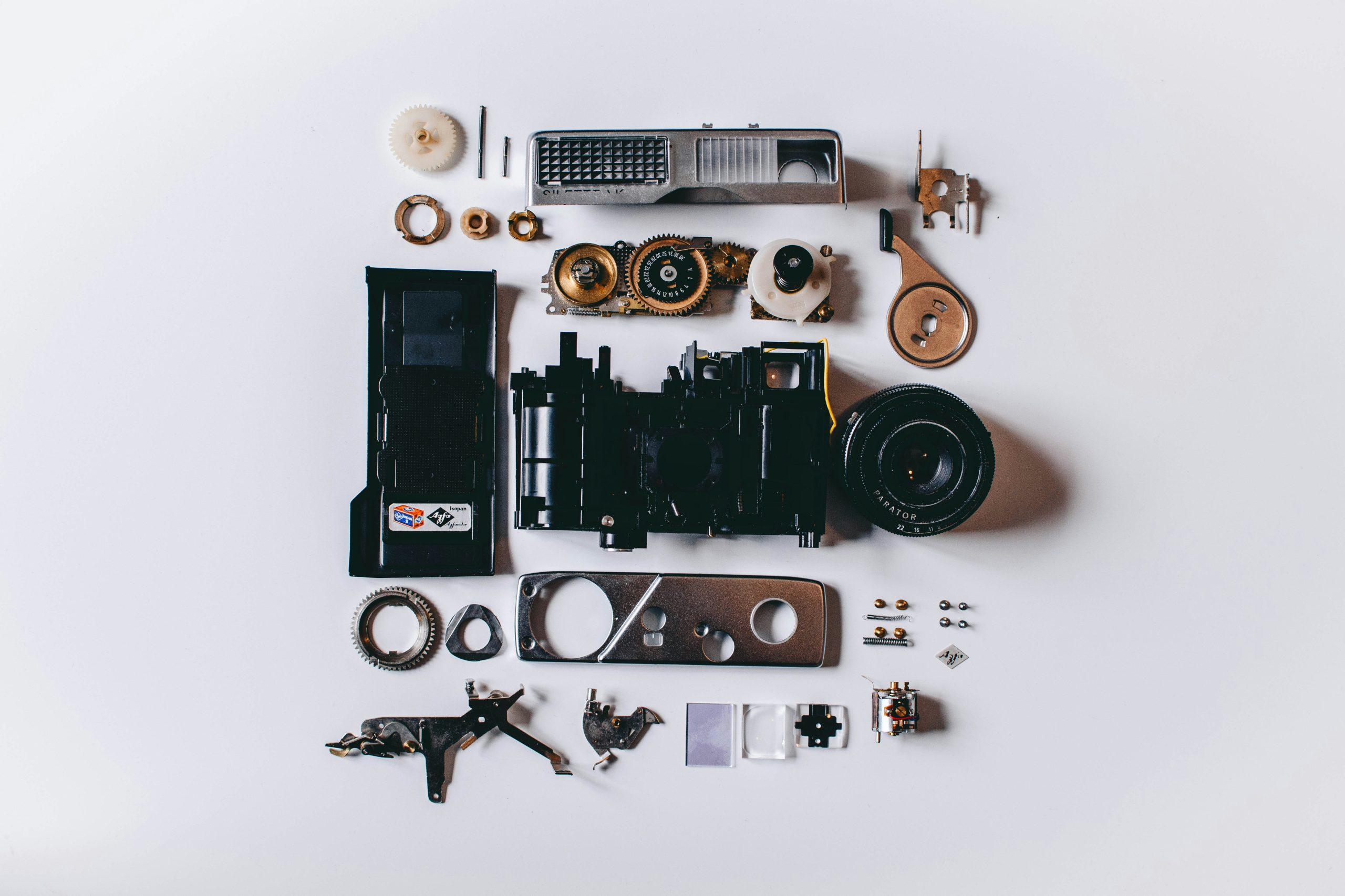 A camera is broken down into its parts.