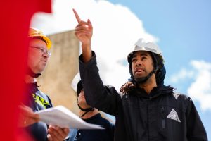 Engineer gives directions to construction workers