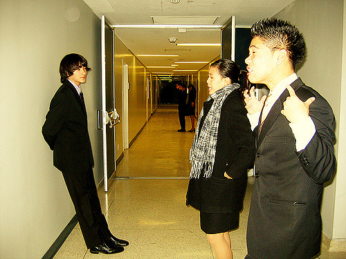 Students practicing their speeches in the hallway