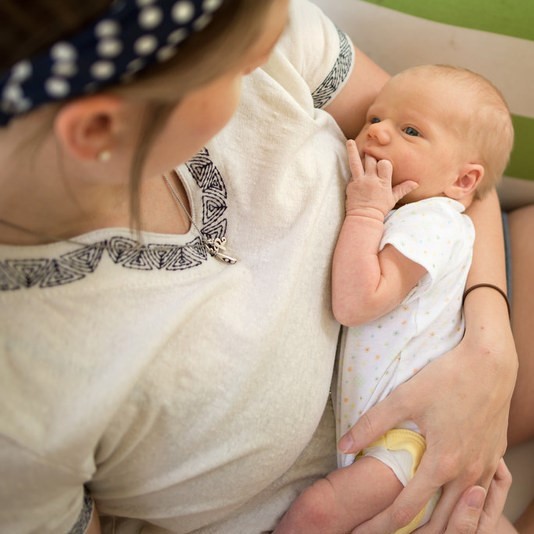 Photo of a mother holding an infant