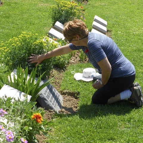 woman at a gravestone