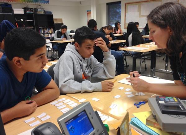 Photo of teens receiving tutoring support.