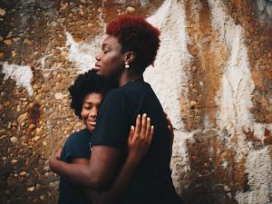 A parent and child hugging