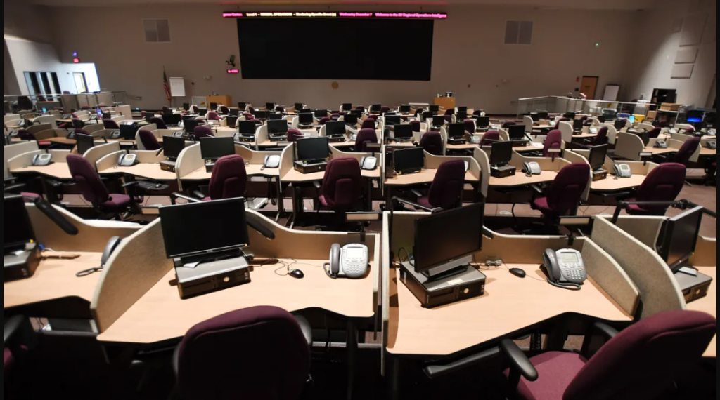photo of the desks and big screen tv at New Jersey's State Emergency Operations Center.