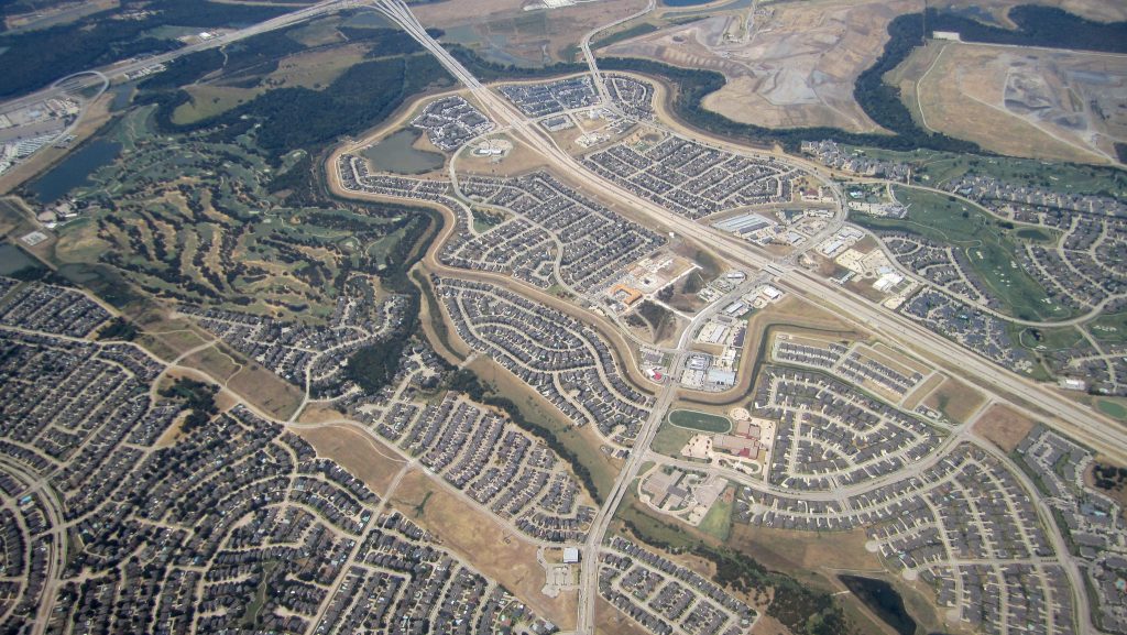 An aerial photo of a sprawling suburban neighborhood