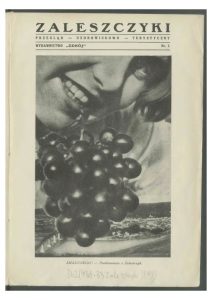 Page from an old magazine showing a photograph of a woman holding the stem of a bunch of ripe, black grapes from her mouth, with the title 'Zaleszczyki'