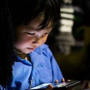 Young boy exploring content on a smart phone.