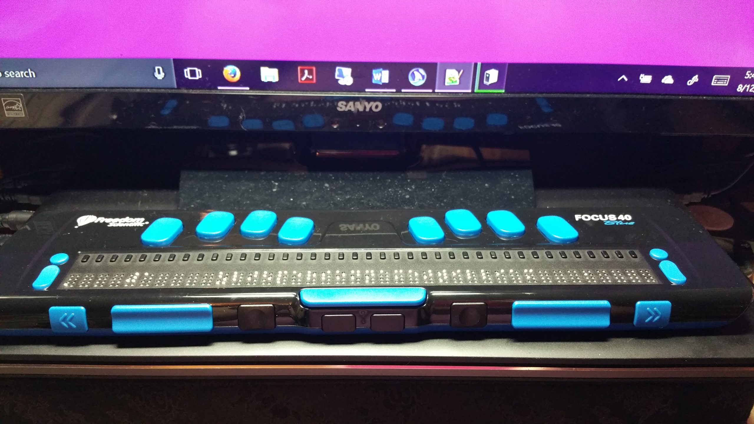 Photo of a Refreshable Braille Display (RBD)/braille keyboard.