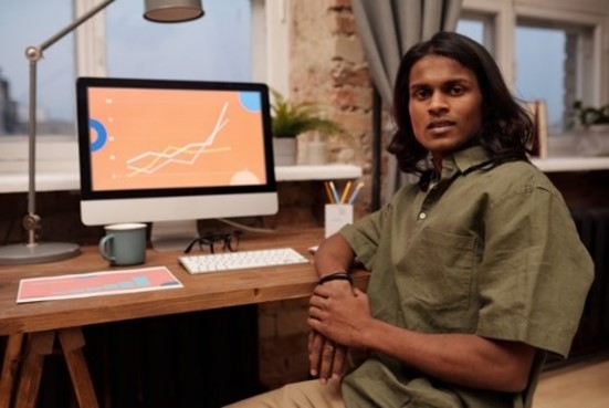 man sitting in front of computer