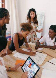 five women in a meeting