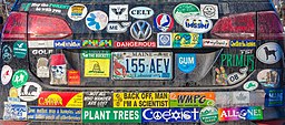 A VW with bumper stickers all over it