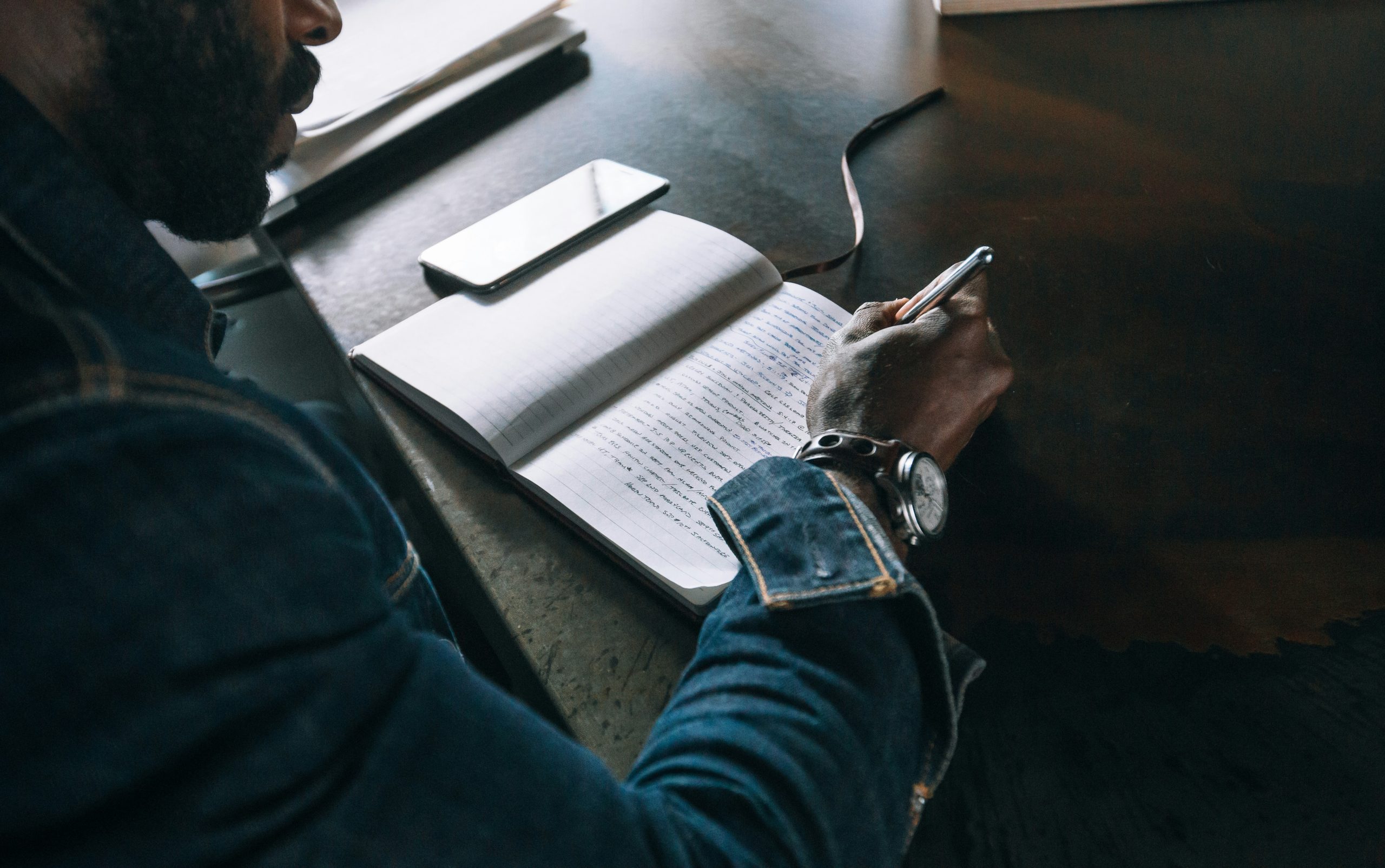 Person Writing in Journal