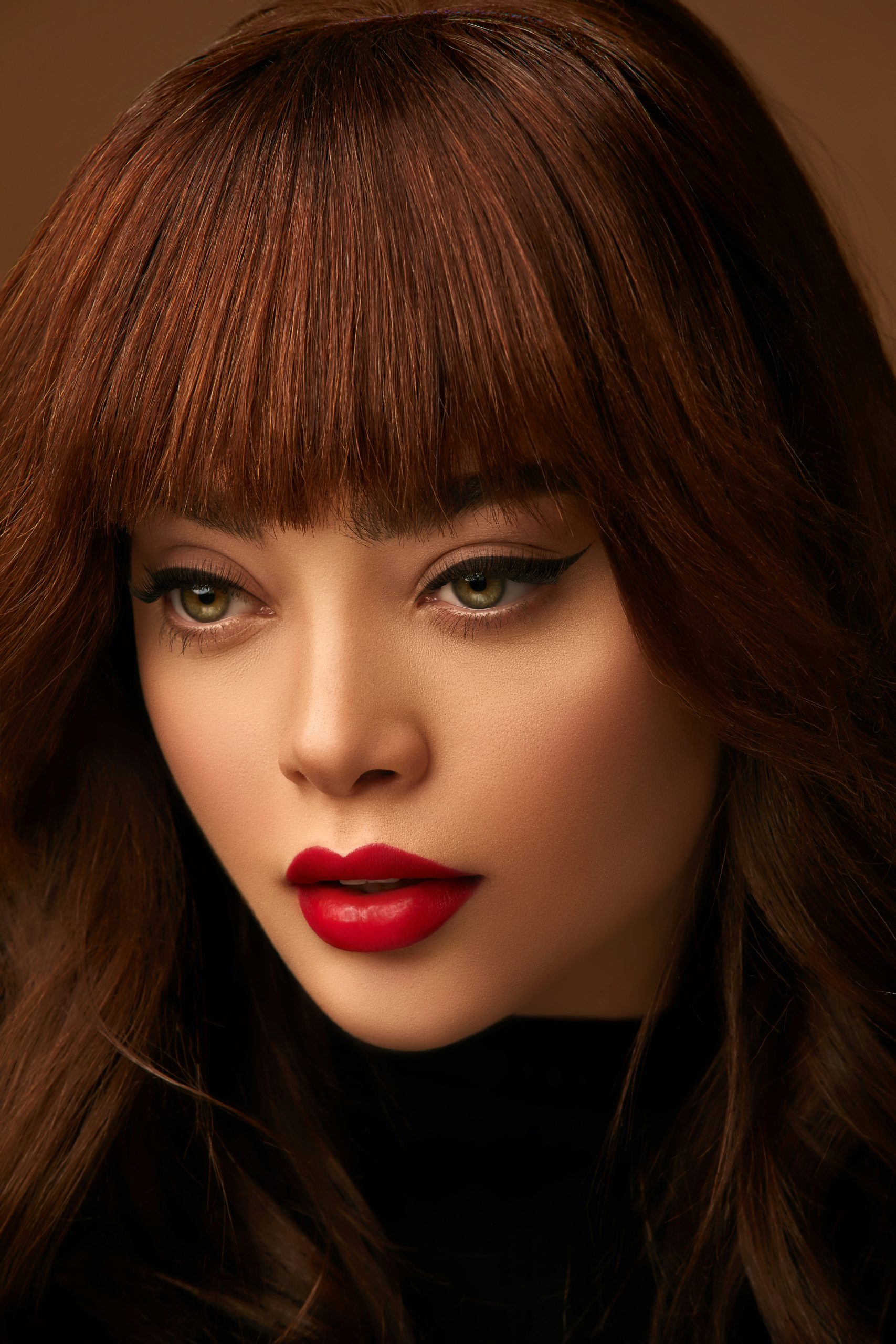 An image shows a beautiful woman with makeup and brown hair