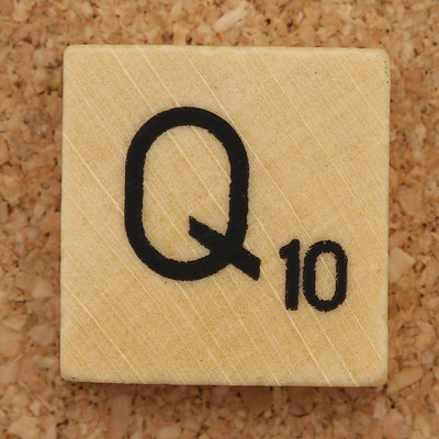 The letter Q in a Scrabble tile
