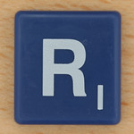 Blue Scrabble tile with R