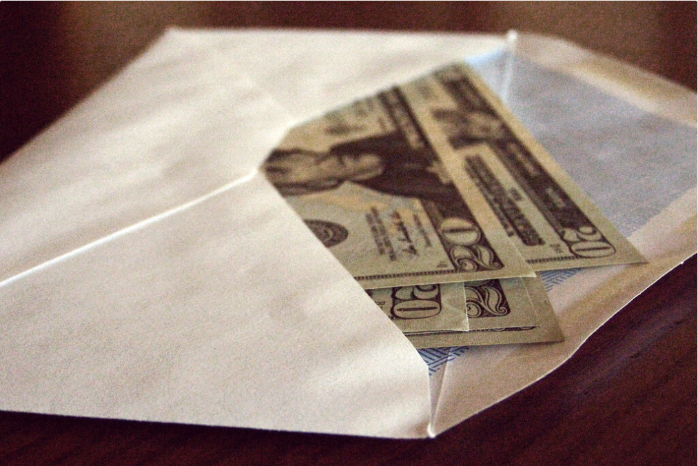 Photograph of money hidden in envelope