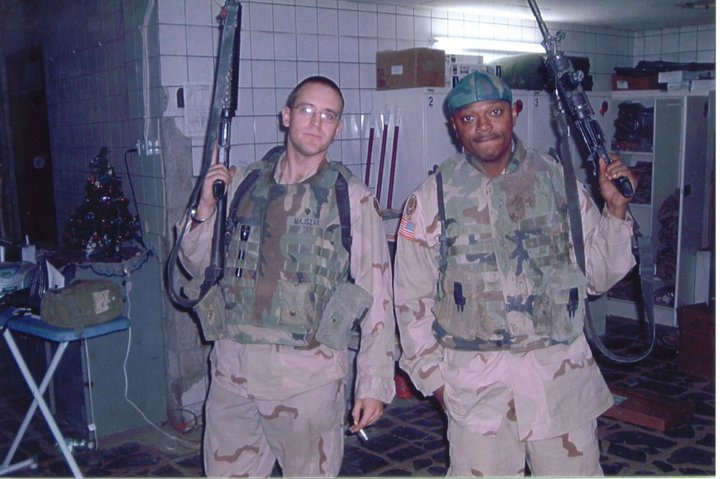 Color photograph of chapter 14 co-author, Brian Majszak, and his friend, Sergent Moore. Both are in fatiques holding service weapons.