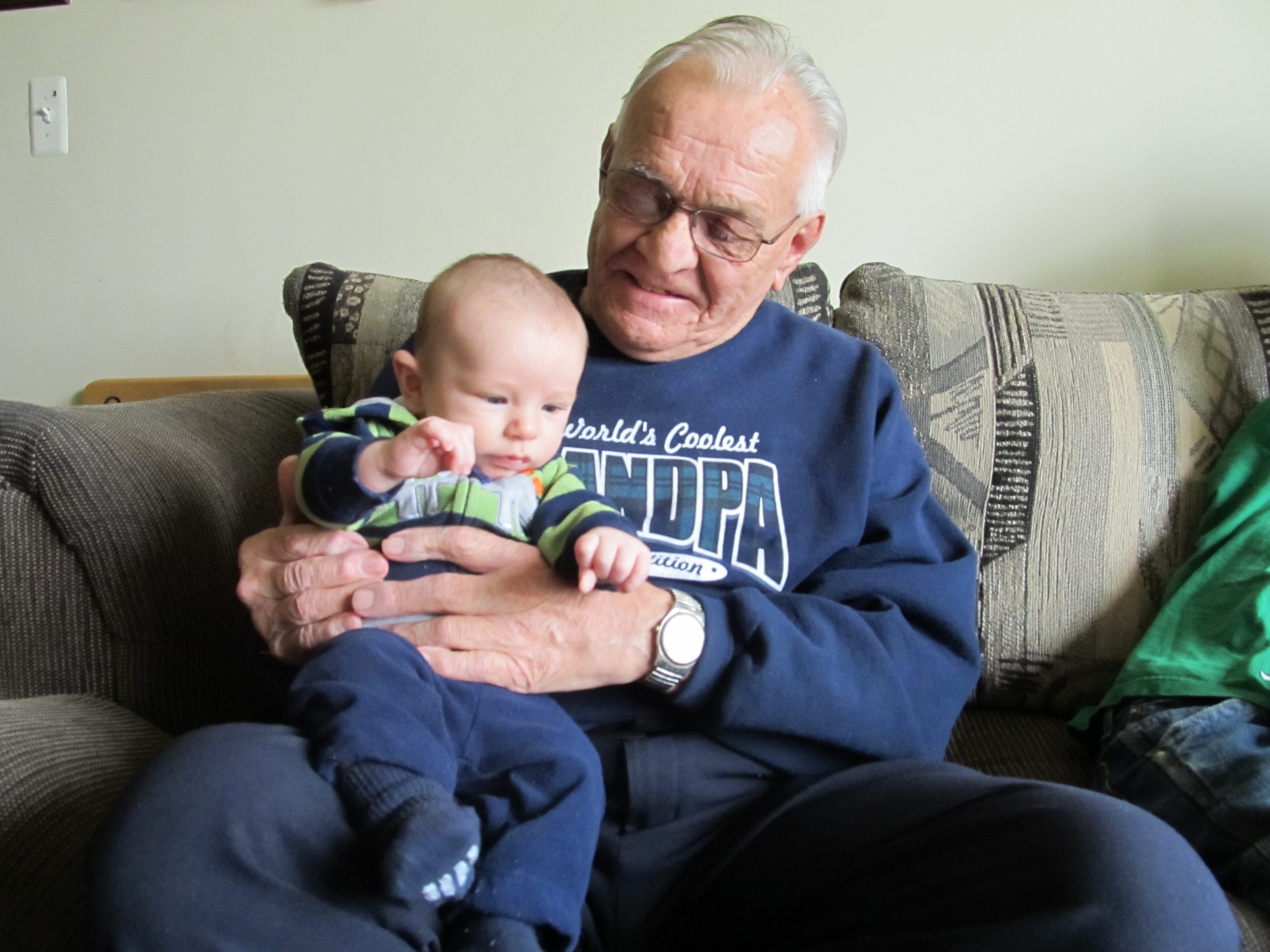 Picture for decorative purposes. It is an elderly man holding his great grandchild.