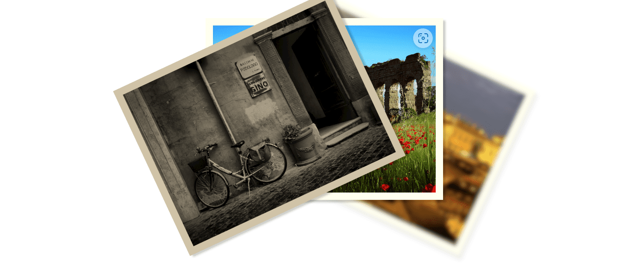 Three images in a pile opened like a fan in front of a white background. The image closest to the front is a black and white photograph of a bicycle next to a flowering pot near a door to a building. The middle image is mostly covered by the previous image, it only shows an old rock structure in a green grass field with red flowers under the clear blue sky. The third image furthest from the screen is a blurry scenery of an old town.
