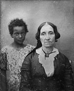 an image of an 1800s slavemaster and slave