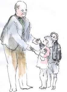 A bald, older man holds the hand of a little boy and girl, who look up at him fondly.