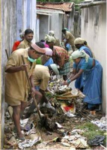 CAPTION : FOR DAILY : TIRUNELVELI : DECEMBER : 30/12/2009 : Conservancy workers of Tirunelveli Corporation cleaning a drainage channel at Melappalayam on Wednesday as part of the mass cleaning programme. Photo: A_Shaikmohideen - CAPTION : FOR DAILY : TIRUNELVELI : DECEMBER : 30/12/2009 : Conservancy workers of Tirunelveli Corporation cleaning a drainage channel at Melappalayam on Wednesday as part of the mass cleaning programme. Photo: A_Shaikmohideen