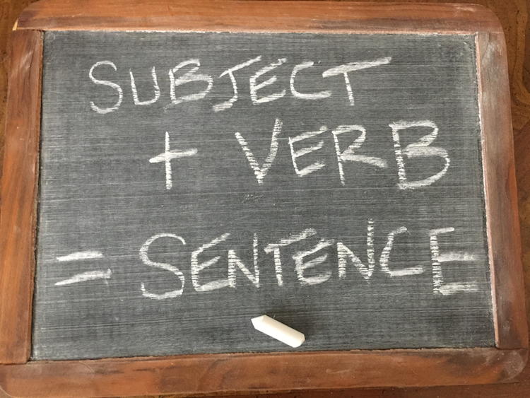 Slate displaying Subject plus verb equals sentence