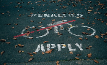 Traffic sign on ground saying No Cycling and penalites apply