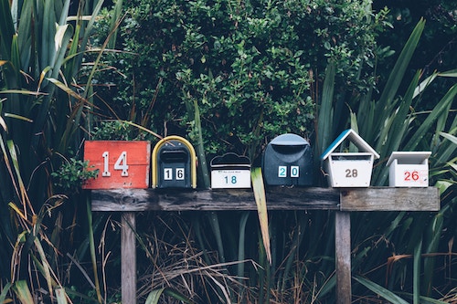 Row of mailboxes attached on a post