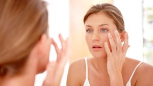 "Woman applying moisturizer"by http://goodfreephotos.com is in the Public Domain