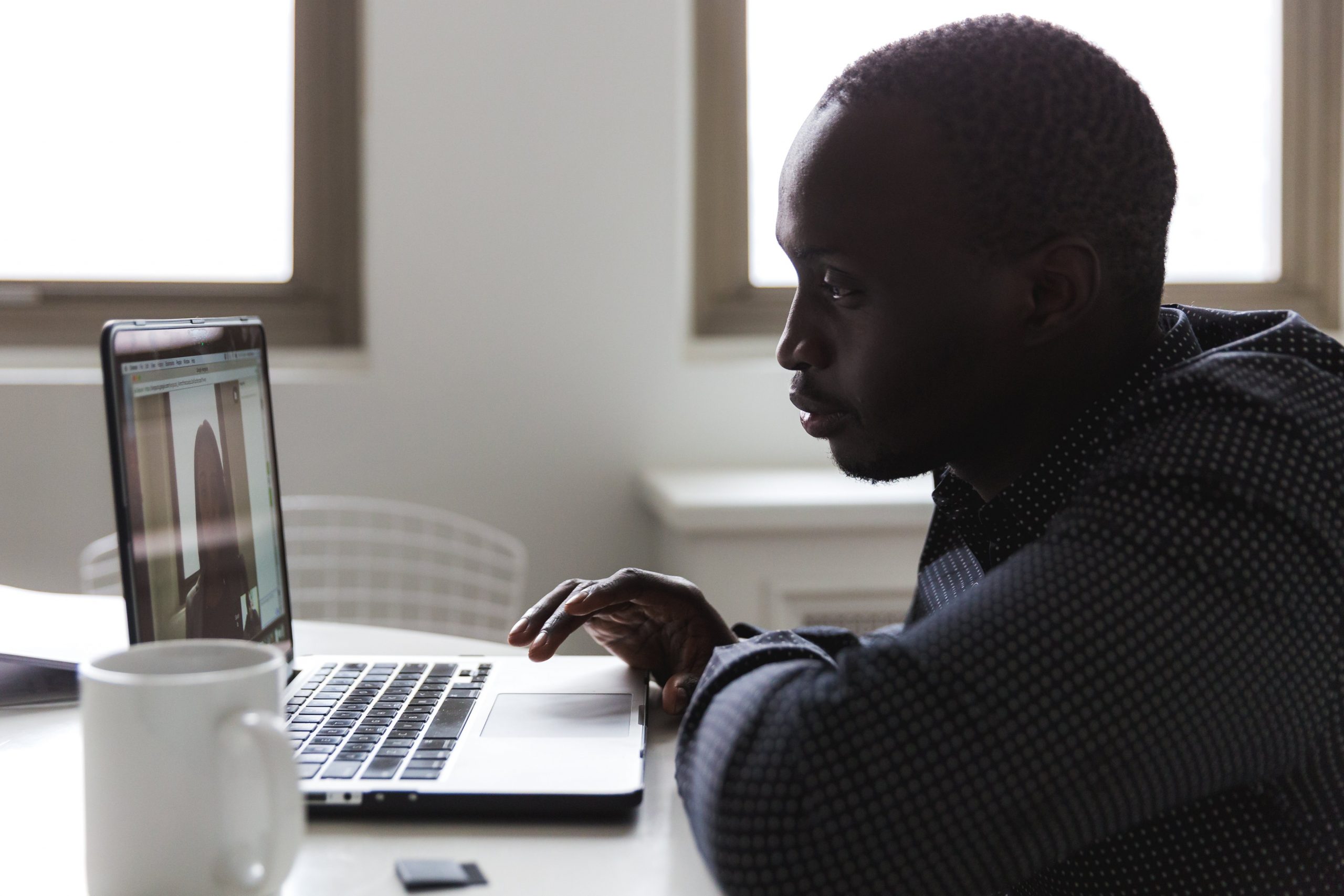 Man in a video meeting