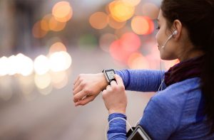 Woman using smart watch for a workout