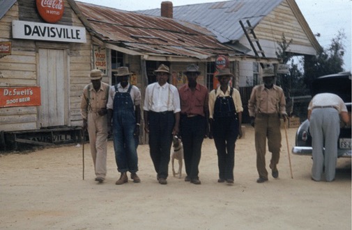 Six African American men walking together in the early 1900's.
